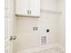 Bright laundry room with white cabinets and detailed trim at 1008 Peedin Rd, Selma, NC 27576