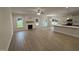 Open-concept living room boasts hardwood floors, a fireplace, recessed lighting and a ceiling fan at 1008 Peedin Rd, Selma, NC 27576