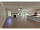 Spacious living area with fireplace, hard wood floors, and an open-concept design to the kitchen at 1008 Peedin Rd, Selma, NC 27576