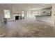 Bright living room featuring a fireplace, windows, and access to the patio with abundant natural light at 1008 Peedin Rd, Selma, NC 27576
