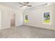 Large main bedroom features recessed lighting and two large windows at 1008 Peedin Rd, Selma, NC 27576