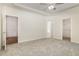 Open main bedroom with neutral colors and a view of the main bath and closet at 1008 Peedin Rd, Selma, NC 27576