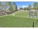 Extensive backyard with well-maintained lawn, play equipment, and secure fencing at 1016 Leatherstone Ln, Fuquay Varina, NC 27526