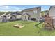 Large backyard showing play set, trampoline, sandbox, and ample green space at 1016 Leatherstone Ln, Fuquay Varina, NC 27526