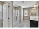 A bathroom with double vanity, glass shower and tile flooring at 1016 Leatherstone Ln, Fuquay Varina, NC 27526
