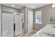 Bathroom features double sinks, a glass shower, and a window for natural light at 1016 Leatherstone Ln, Fuquay Varina, NC 27526