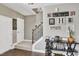 Inviting entryway featuring wood floors and staircase with an iron handrail, complemented by stylish decor at 1016 Leatherstone Ln, Fuquay Varina, NC 27526