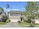 Charming two-story home features a well-maintained front yard and a convenient two-car garage, creating a welcoming curb appeal at 1016 Leatherstone Ln, Fuquay Varina, NC 27526