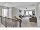 Cozy loft area with plush seating, neutral colors, and natural light from windows at 1016 Leatherstone Ln, Fuquay Varina, NC 27526