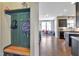 Mudroom with wood bench and hooks leads into living area with large windows at 1016 Leatherstone Ln, Fuquay Varina, NC 27526