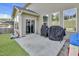 Outdoor patio with sliding glass door and grill at 1016 Leatherstone Ln, Fuquay Varina, NC 27526