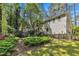 The home has a spacious backyard with mature trees and lush landscaping, perfect for outdoor enjoyment at 108 Maplewood Dr, Knightdale, NC 27545