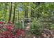 Backyard garden pathway featuring a decorative archway and lush landscaping at 108 Maplewood Dr, Knightdale, NC 27545
