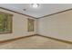 Bedroom with carpeting and wooded views from the two windows at 108 Maplewood Dr, Knightdale, NC 27545
