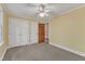 Bedroom features two double closets, a window and ceiling fan at 108 Maplewood Dr, Knightdale, NC 27545
