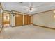 Spacious bedroom with neutral carpet, wood trim, and a ceiling fan at 108 Maplewood Dr, Knightdale, NC 27545