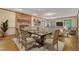 Elegant dining room with hardwood floors, brick fireplace, and seamless flow into the living area at 108 Maplewood Dr, Knightdale, NC 27545