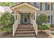 Charming front porch with brick steps, a covered entrance, and decorative plants enhancing curb appeal at 108 Maplewood Dr, Knightdale, NC 27545