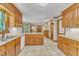An open kitchen design provides ample space for cooking and entertaining, with granite countertops and wood cabinetry at 108 Maplewood Dr, Knightdale, NC 27545