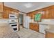 Bright and spacious kitchen area showcasing granite countertops and wooden cabinets at 108 Maplewood Dr, Knightdale, NC 27545