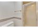 Bathroom shower with sliding glass door and gold hardware at 108 Maplewood Dr, Knightdale, NC 27545