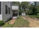 Charming outdoor porch with outdoor seating and nearby shed at 1106 Sycamore St, Rocky Mount, NC 27801