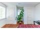 Bright bedroom with hardwood floors and three white doors at 1106 Sycamore St, Rocky Mount, NC 27801