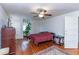 Comfortable bedroom with hardwood floors, ceiling fan, and a large bed at 1106 Sycamore St, Rocky Mount, NC 27801