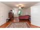 Spacious bedroom features a ceiling fan, hardwood floors, and natural light at 1106 Sycamore St, Rocky Mount, NC 27801
