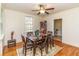 Cozy dining room with hardwood floors, a ceiling fan and window views at 1106 Sycamore St, Rocky Mount, NC 27801