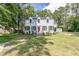 Inviting two-story home with a well-maintained lawn and a detached shed at 1106 Sycamore St, Rocky Mount, NC 27801