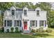 Charming white brick two-story home with a bright red door and manicured landscaping at 1106 Sycamore St, Rocky Mount, NC 27801