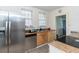 Bright kitchen features stainless steel appliances, double windows, and a view of the doorway at 1106 Sycamore St, Rocky Mount, NC 27801