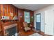 Relaxing living room features hardwood floors, a cozy fireplace, and a view of the entry door at 1106 Sycamore St, Rocky Mount, NC 27801