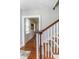 Staircase with wood railing at 1106 Sycamore St, Rocky Mount, NC 27801