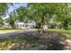 Large yard featuring a two-story house, shed, and lush greenery at 1106 Sycamore St, Rocky Mount, NC 27801