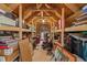 This attic is fully decked with wooden supports, shelves, carpet, and items for storage at 112 Natchez Ct, Cary, NC 27519