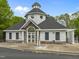Community clubhouse featuring a unique design, stone accents, and well-maintained surroundings at 112 Natchez Ct, Cary, NC 27519
