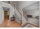 Spacious foyer features hardwood floors, staircase, and opens into the living room and kitchen at 112 Natchez Ct, Cary, NC 27519