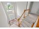 Bright foyer featuring hardwood stairs, large window, and welcoming entrance at 112 Natchez Ct, Cary, NC 27519