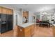 Spacious kitchen with an island, wood floors and modern appliances at 112 Natchez Ct, Cary, NC 27519