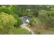 Overhead view of a house featuring a circular driveway and surrounded by mature trees at 119 Johnson St, Broadway, NC 27505
