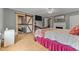 Cozy bedroom featuring hardwood floors, a ceiling fan, and an ensuite bathroom, offering comfort and convenience at 119 Johnson St, Broadway, NC 27505