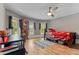 Cozy bedroom with bright windows, light wood floors, and a ceiling fan at 119 Johnson St, Broadway, NC 27505