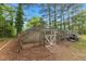 Enclosed chicken coop and garden area for raising chickens and growing produce at 119 Johnson St, Broadway, NC 27505