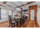 Bright dining room featuring wood floors, high ceilings and rustic wood beams at 119 Johnson St, Broadway, NC 27505