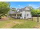 View of house showing fence, lawn, porch, and the exterior of the home at 119 Johnson St, Broadway, NC 27505