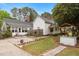 Charming exterior of home featuring a well and manicured lawn at 119 Johnson St, Broadway, NC 27505