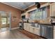 Charming kitchen features stainless steel appliances, granite counters, sink, and a dining area at 119 Johnson St, Broadway, NC 27505