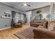 Inviting living room features hardwood floors, comfortable seating, and stylish decor, perfect for relaxation at 119 Johnson St, Broadway, NC 27505